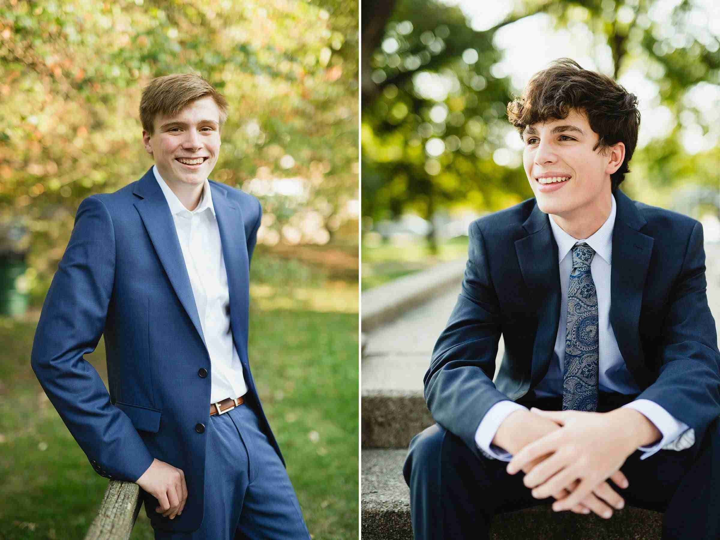 Two boys both dressed in suits, one with a tie.