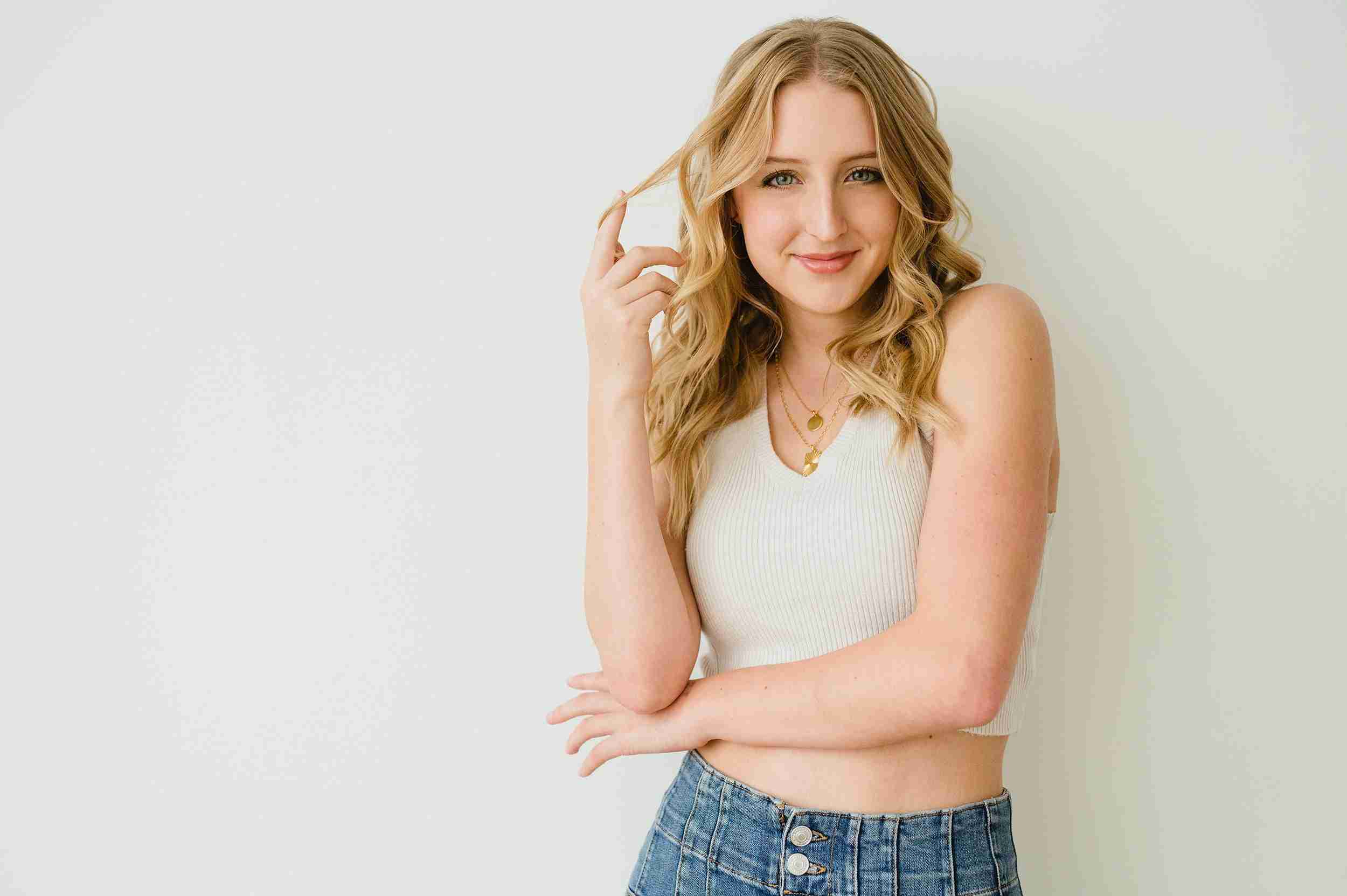 girl white shirt hand in hair