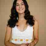 What to Ask Your Senior Photographer Before Booking – senior girl photos in studio wearing white crochet top on tan backdrop– award-winning Chicago senior photographer Shalimar B. Photography.