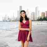 What to Ask Your Senior Photographer Before Booking – Chicago senior girl photos at north avenue beach in red dress – award-winning Chicago senior photographer Shalimar B. Photography.
