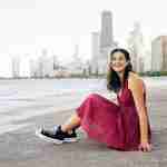 What to Ask Your Senior Photographer Before Booking – Chicago senior girl photos at north avenue beach in red dress – award-winning Chicago senior photographer Shalimar B. Photography.