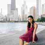 What to Ask Your Senior Photographer Before Booking – Chicago senior girl photos at north avenue beach in red dress – award-winning Chicago senior photographer Shalimar B. Photography.