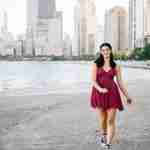 What to Ask Your Senior Photographer Before Booking – Chicago senior girl photos at north avenue beach in red dress – award-winning Chicago senior photographer Shalimar B. Photography.