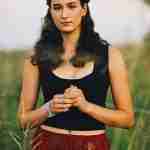 What to Ask Your Senior Photographer Before Booking – Chicago senior girl photos grassy field – award-winning Chicago senior photographer Shalimar B. Photography.